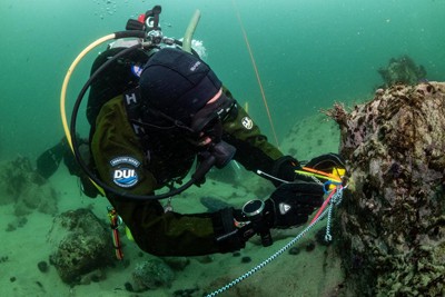 Dan Abbott installing a temperature logger along benthic line at Big Sur Reef Restoration site