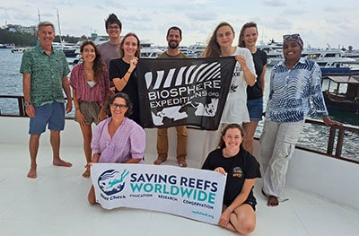 Volunteers participating in Reef Check conservation efforts at a marine site.